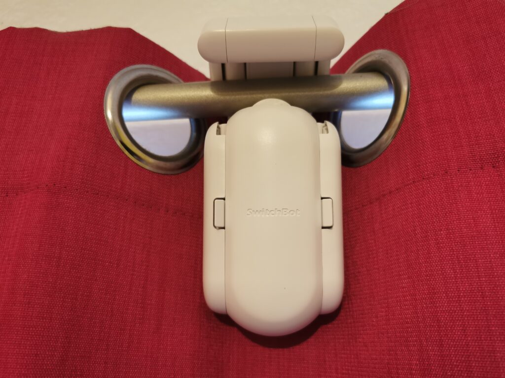 The SwitchBot Curtain actually sits on the other side of the rings, so it not visible, normally